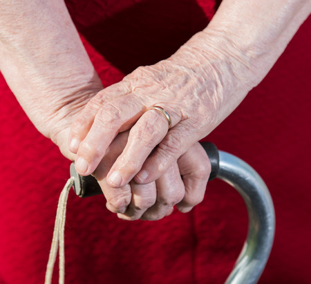 Hands of old woman on a caneの写真素材