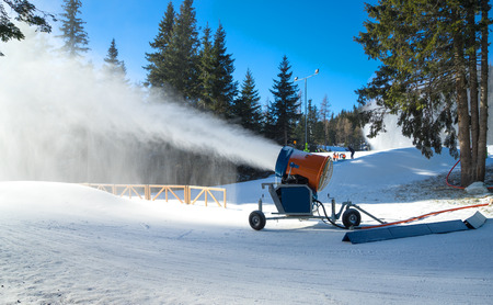 Snow cannon  in action  at ski resortの写真素材