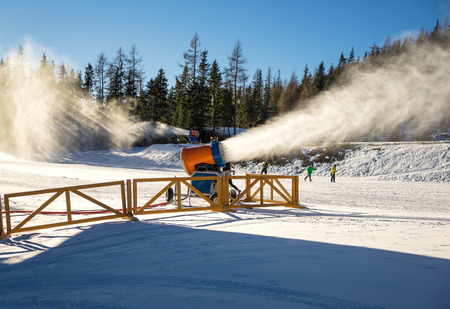 Snow cannon in action at ski resortの写真素材