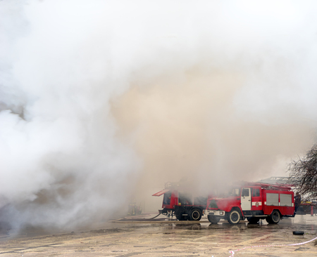 Fire and strong smoke covering buildingの写真素材