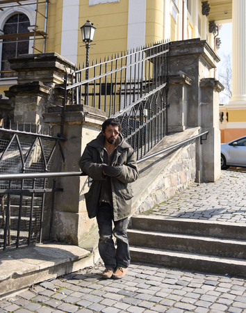 Homeless man on the street of the city. Neurofibromatosis. Three-dimensional skin formationの写真素材