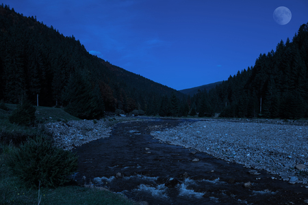 Mountain river in Carpathian mountains, Ukraine at nightの写真素材