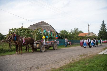 HEYIVCI,UKRAINE - SEPTEMBER 09, 2016: Harvest day celebration in hungarian village in Heyivci, Ukraine. Happy people dancing and having funのeditorial素材