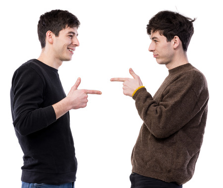 Two handsome young men posing on a white background. Twin brothersの写真素材