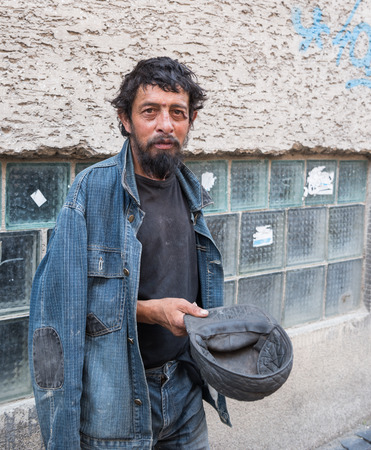 Homeless man on the street of the city