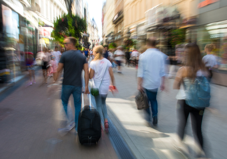 Busy city people going along the street. Intentional motion blurの写真素材