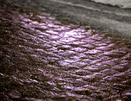 Abstract urban background. Streets  with reflections on ice-crusted ground. Pavement textureの写真素材