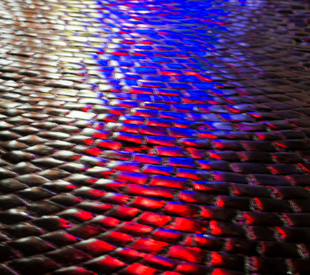 Abstract urban background. Streets after rain with reflections of light on wet roadway. Pavement...