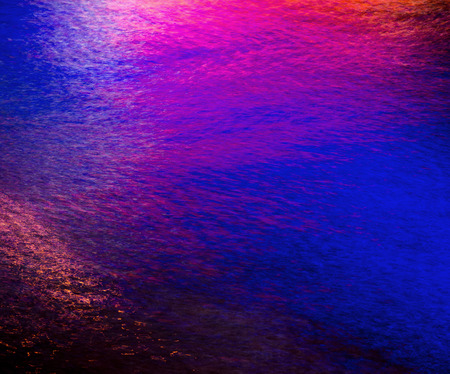 Colorful light reflection on the water. Abstract water backgroundの写真素材