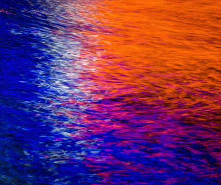 Colorful light reflection on the water. Abstract water backgroundの写真素材