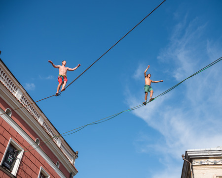 LUBLIN, POLAND - JULY 27, 2018: Rope walkers at urban highline festival placed in city space of Lublin. Lublin is one of the biggest cities in Poland.のeditorial素材