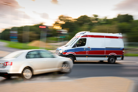Car accident.Car and ambulance crashed on the city road. Intentional motion blurの写真素材