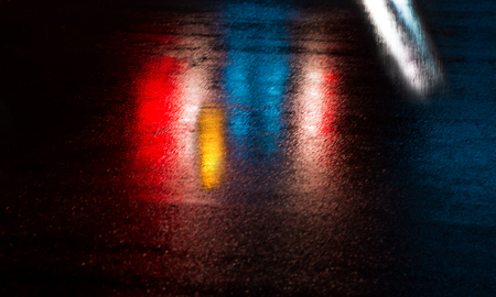 Abstract urban background. Lights and shadows of New York City. NYC streets after rain with...