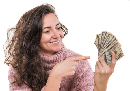 Sale, business, finance, banking concept. Smiling woman posing with us dollar money on a white backgroundの写真素材