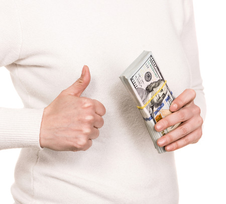 Money, finances, investment and saving concept. Woman  with pack of dollar cash money  over white...