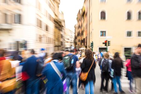 Busy city street people on zebra crossing. Intentional motion blur. Defocused image