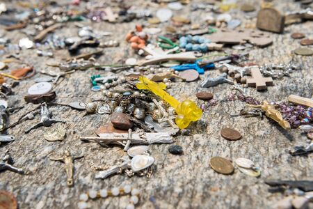 SIAULIAI, LITHUANIA - JULY 28, 2019:A large number of wooden crosses and crucifixes at the Hill of Crosses. Ð¢ext on the crosses in different languages - O God, protect our family, give healthのeditorial素材
