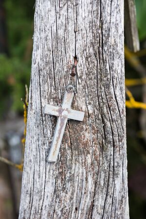 SIAULIAI, LITHUANIA - JULY 28, 2019:A large number of wooden crosses and crucifixes at the Hill of Crosses. Ð¢ext on the crosses in different languages - O God, protect our family, give healthのeditorial素材