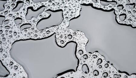 Close up water drops on metal surface can be used for web design. Abstract texture backgroundの写真素材