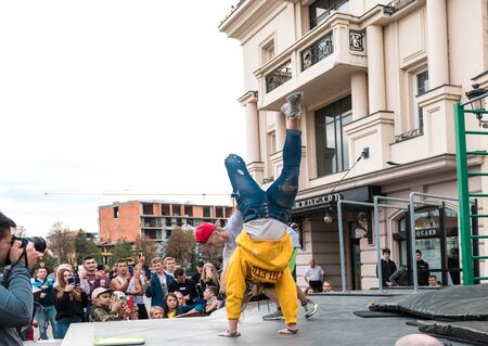 UZHHOROD,UKRAINE - SEPTEMBER 28, 2019: Unidentified athlete performs during the street workout championship in Uzhhorod, Ukraineのeditorial素材
