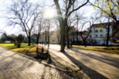Abstract blurred background. Soft focus image of autumn city park. Late fall. Defocused imageの写真素材