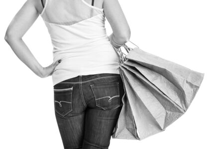 Sale and shopping concept. Woman posing with  shopping bags on a white backgroundの写真素材
