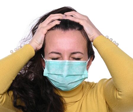 Healthcare, stress and headache concept. Brunette having headache. Stressed woman over white...