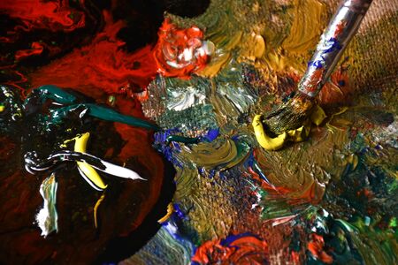 Artist mixing color oil painting on palette. Palette with paintbrush. Art palette