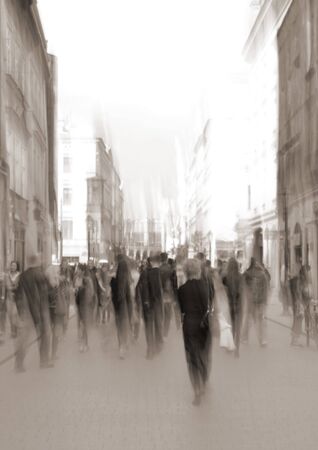 Busy city people eople going along the street. Intentional motion blur. Defocused imageの写真素材