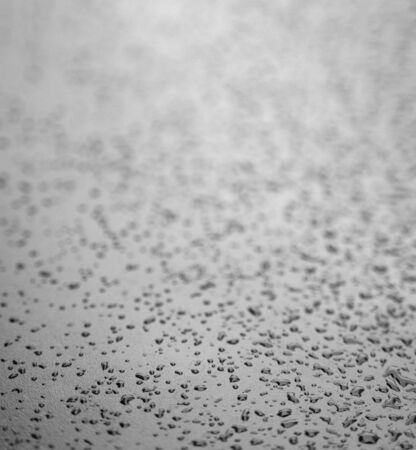 Close up water drops on metal surface can be used for web design. Abstract texture backgroundの写真素材