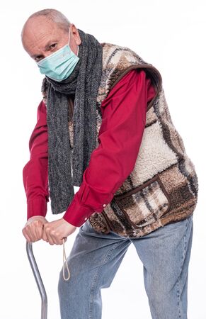 Healthcare concept. Unhappy senior man suffering from pain in back or reins over white backgroundの写真素材