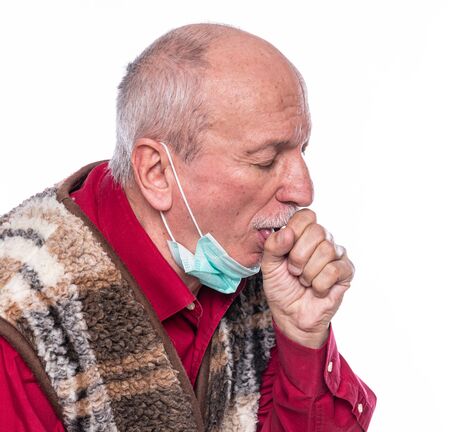 Healthcare and medicine concept. Senior man in mask suffering from coughing isolated on white backgroundの写真素材
