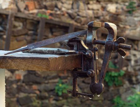Old rusty vise for metal products outdoors