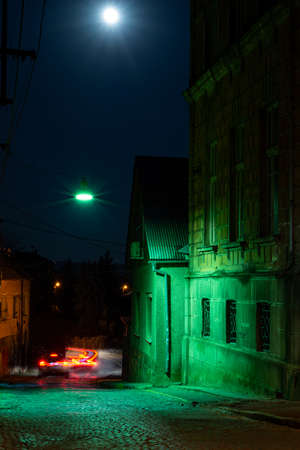 UZHHOROD, UKRAINE - APRIL 08, 2020: Streets and architecture of the old city of Uzhgorod in Ukraine at nightのeditorial素材