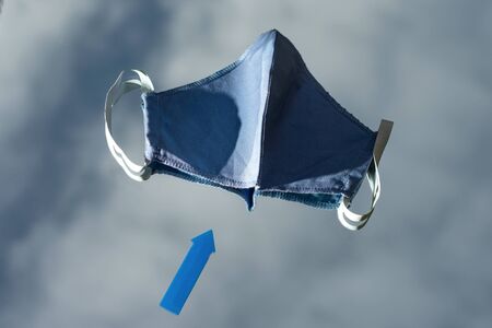 Healthcare and medical concept. Protective medical masks on mirror