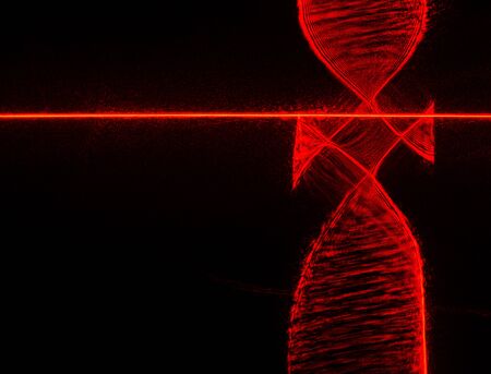 Abstract red lines drawn by light on a black background. Laser lines