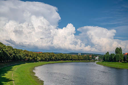 UZHHOROD, UKRAINE - JUNE 25, 2020: Panorama of the river Uzh and the central part of the Uzhhorod...