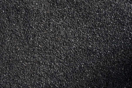 Rough surface of asphalt. Tarmac gray grainy road, texture backgroundの写真素材