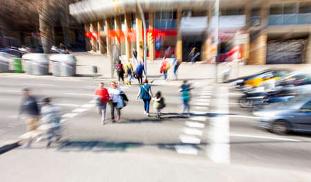 Busy city street people on zebra crossing. Intentional motion blur. Defocused imageの写真素材