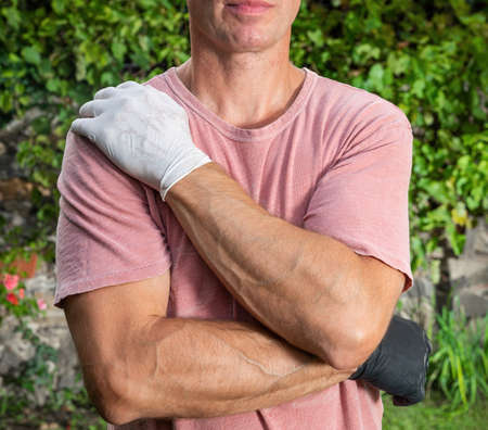 Healthcare concept. Man in protective gloves posing outdoorsの写真素材