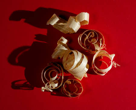 Woodworking concept. Sawdust on a red background
