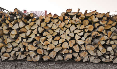 Pile of wood logs ready for winter. Wood logs texture background