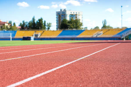 UZHHOROD, UKRAINE - SEPTEMBER 5, 2020: Red running track on the stadium in Uzhhorod, Ukraineのeditorial素材
