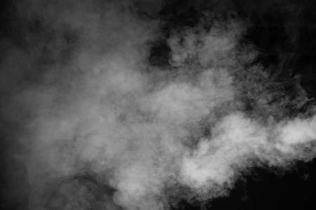 Abstract black and white smoke  over the black backgroundの写真素材