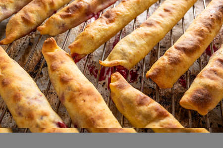 Dessert concept. Baked cherry sticks for pie Monastic hut  at home