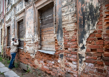 Photographer taking pictures of old architecture detailsの写真素材