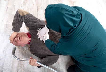 Healthcare and medical concept. Woman giving first aid to an elderly manの写真素材