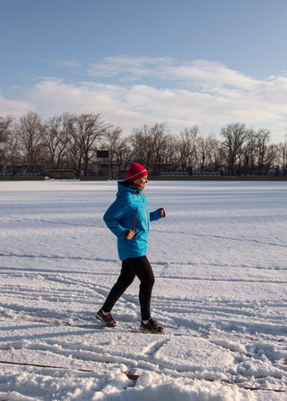 Sport, fitness, jogging  and motivation concept. Healthy active woman running outdoor