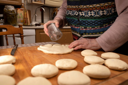 Homemade food concept. Woman making dough balls for cooking pastries at home