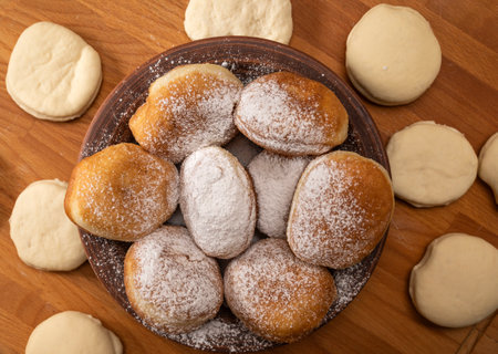 Homemade food concept. Fried yeast dough donuts on a wooden table